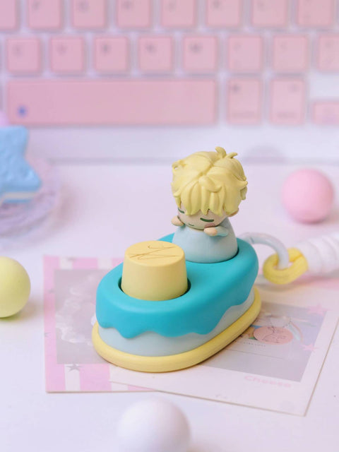 The Luka keycap featuring blonde hair and a soft blue outfit atop a blue and yellow cake base.