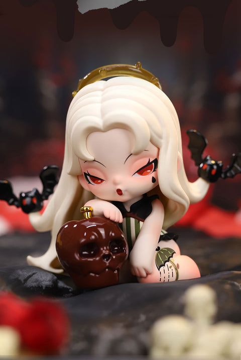 A gothic-style collectible figurine from the "DODO NAMI Paradise of Doom" series features a pale-skinned character with long, flowing white hair and red eyes. She wears a dark green and black corset-style dress, and a golden halo drips with eerie liquid. Small black bats with red eyes flutter around her hair. She leans on a glossy skull-shaped apple, evoking a dark fairytale aesthetic. Her intense expression and the shadowy background enhance the mysterious and haunting atmosphere.