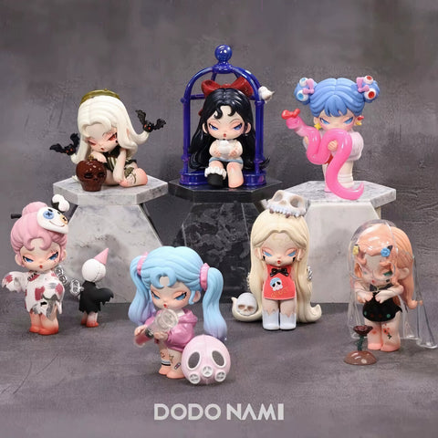 A collection of intricately designed fantasy-themed figurines from the "DODO NAMI Paradise of Doom" series is displayed on a dark, moody background. Each character features unique eerie and gothic elements, such as skulls, bats, mystical creatures, and haunting expressions. The figurines have pastel and vibrant hair colors, detailed outfits, and accessories that reflect a spooky yet charming aesthetic. Some are posed with eerie objects, while others are encased in cages or veils.