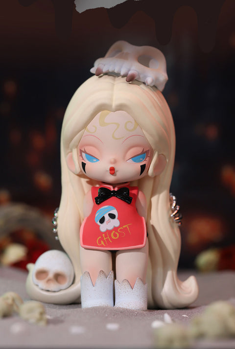 A gothic-style collectible figurine from the "DODO NAMI Paradise of Doom" series features a pale character with long, flowing blonde hair and piercing blue eyes. She wears a red dress with a skull design and the word "GHOST" printed on it, accented by a black bow. A bone-like crown rests on her head, while skeletal elements surround her. Her expression is cold and enigmatic, blending eerie charm with a supernatural aura, set against a dark, haunting background.