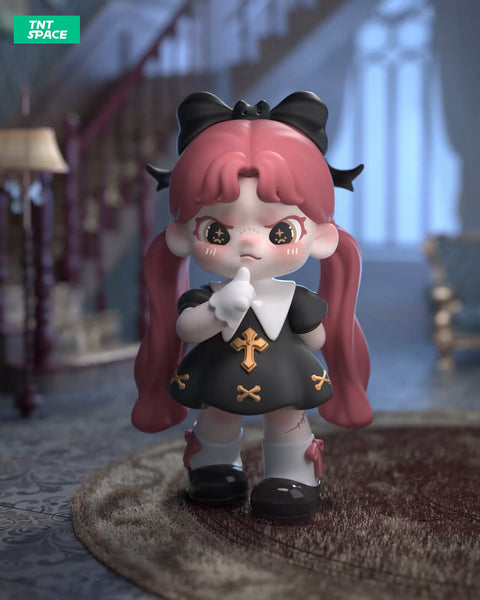 A 3D-rendered Dora figurine stands in a dimly lit, vintage-style mansion with a mysterious aura. She has long red twin-tails, adorned with a black bow, and star-shaped pupils. Dressed in a gothic black dress with gold cross details, white gloves, and black shoes with red ribbons, she raises a finger to her lips in a "shushing" gesture. Subtle stitches on her legs and a shadowy staircase in the background add to the eerie, secretive atmosphere of the scene.