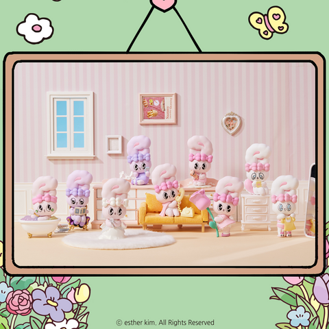 A lineup of pastel bunny figures from the Esther Bunny Young Blossom Series are arranged in a pink room with striped wallpaper. Each bunny has unique poses and accessories like books, roses, phones, and bathtubs. The warm lighting and floral details create a cozy bedroom feel.