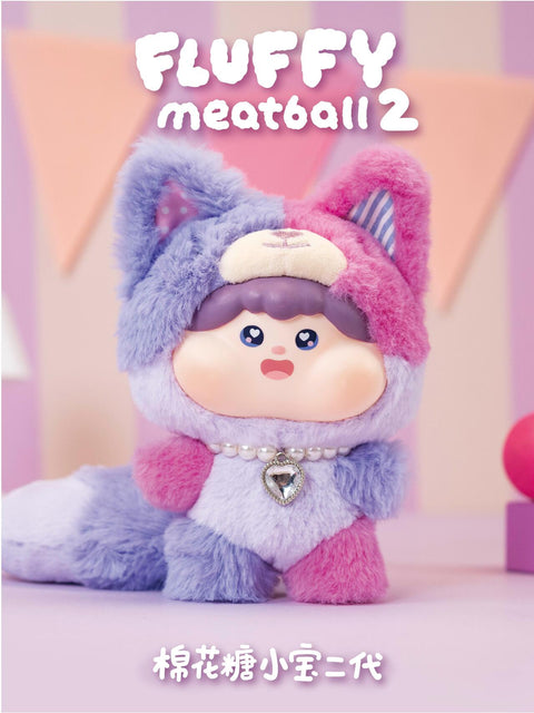 Purple fox plush with violet and pink tones, oversized ears, and a heart-shaped gem necklace. Its long tail and fuzzy texture complement the pastel design, highlighting the enchanting animal-themed fantasy look.
