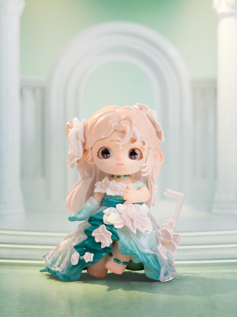 Springtime Overture figure from Joy Twinkling Starlights Series, dressed in layered green and white floral gown with flower accessories, smiling with pastel hair and delicate details.