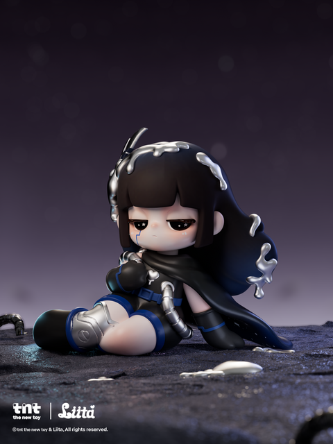 A dark-themed figurine with black hair and silver liquid-like accents sits against a deep purple starry backdrop on a rocky surface. She wears a black cape, blue-trimmed outfit, and metallic boots. Small patches of reflective silver material pool near her as she rests with a calm, serious expression.