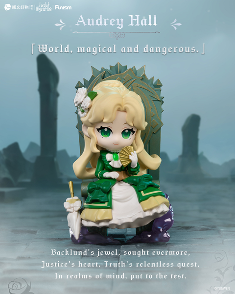 Audrey Hall, a blonde figure with green eyes, sits gracefully on a green and gold throne holding a folding fan. She wears a layered white and emerald dress adorned with bows and roses, with an umbrella resting beside her. The misty ruins background sets a mystical tone.