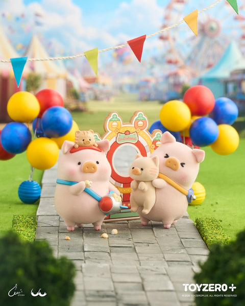 Two pig figurines stand on a paved amusement park pathway. One pig carries popcorn in a blue scoop, while the other holds a smaller pig plush. Behind them is a circular carnival frame with lights and balloons in red, yellow, and blue. A ferris wheel and tents blur softly in the background.