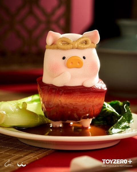 An adorable LuLu the Piggy figure merged with a thick slab of glazed braised pork belly, served on a white plate with bok choy and rich brown sauce.