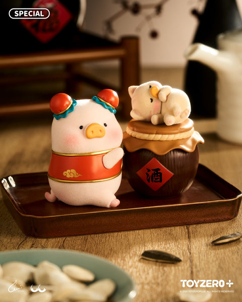 A festive LuLu the Piggy figure in a red and gold outfit standing next to a traditional brown clay liquor jar labeled with the Chinese character for "alcohol." A smaller piggy sleeps on the lid.