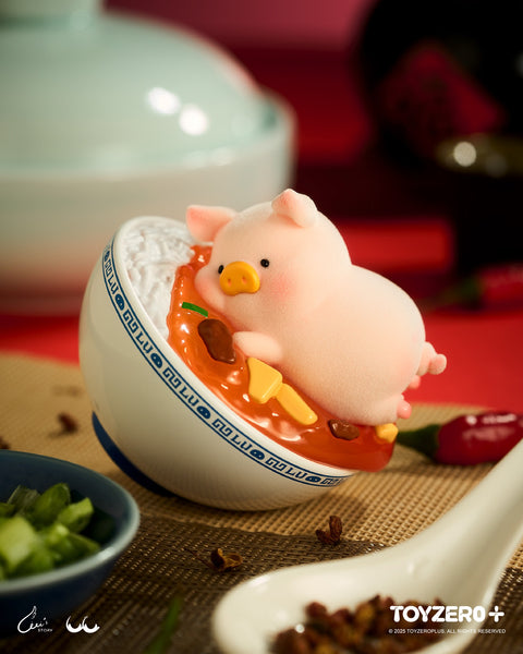 A cute LuLu the Piggy vinyl figure lounging inside a ceramic bowl of mapo tofu and white rice. The scene is detailed with Sichuan peppercorns, green onions, and a ceramic spoon.