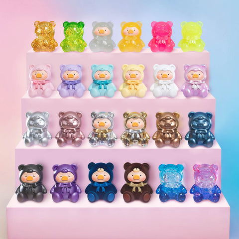A full display of LuLu Teddy Mini figures shows all variants arranged in four rows: glitter crystal bears, pastel gummies, metallic shines, flocked plush, and clear variants.