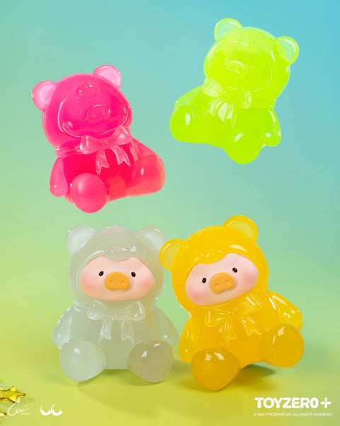 Four semi-transparent neon piggies glow in pink, lime, white, and yellow. Their smooth finishes evoke gummy candy under vibrant lighting.