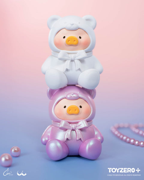 White and iridescent lavender teddy piggies are stacked adorably. Soft pastel tones, glossy finishes, and matching bows emphasize their dreamy candy-like charm.
