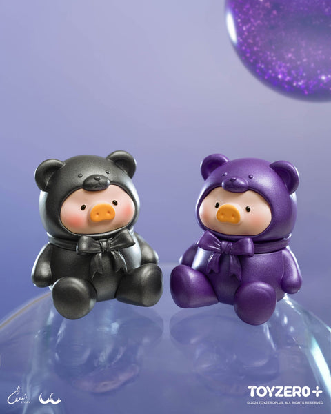 Black and purple teddy piggy figures sit on a shimmering blue sphere. Their metallic finishes gleam under lighting, evoking cosmic elegance.