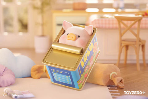 In this whimsical kitchen-themed scene from the “Lulu the Piggy: Stay With You” blind box series, a cute piggy figurine peeks out from inside a colorful tin can designed like a food container labeled “Lulu.” The can is tipped over on a soft surface, surrounded by plush items like a rolling pin, pillow, and cloud-shaped cushion. The cozy background, complete with warm lighting and a dining area, enhances the playful vibe of this adorable hide-and-seek moment.