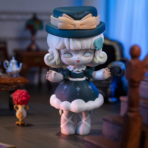 A 3D-rendered MISYA Incredible Mansion Series figure stands elegantly in a dimly lit, vintage-style room. The character has white curly hair, pale blue eyes, and a porcelain-like complexion. She wears a dark teal dress adorned with star-like details, a matching hat with a large bow, and white lace-up stockings. Her delicate hands are raised slightly, adding to her ethereal presence. Antique furniture, a staircase, and soft lighting create a mysterious, gothic atmosphere around her.