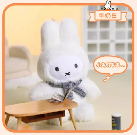 A creamy white plush bunny dressed in a macaron-style fuzzy suit with tall ears and rounded proportions. The character’s white face includes simple black eyes and an X-shaped mouth, accented by a neutral scarf for a clean, cozy, and minimal visual look.