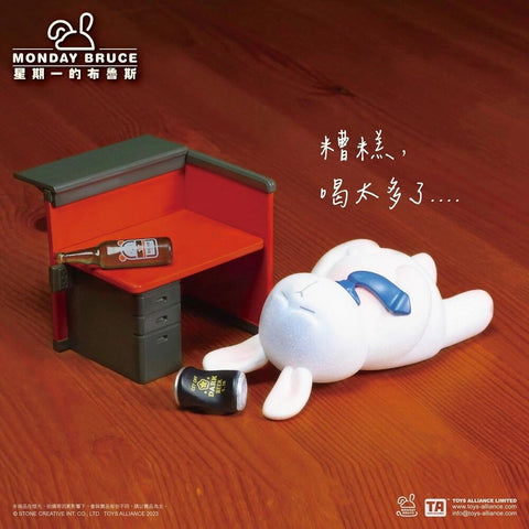 This figure shows a bunny collapsed on the floor in front of a desk, surrounded by empty bottles. With a necktie loosened and eyes closed, the character humorously portrays having drunk too much after work.