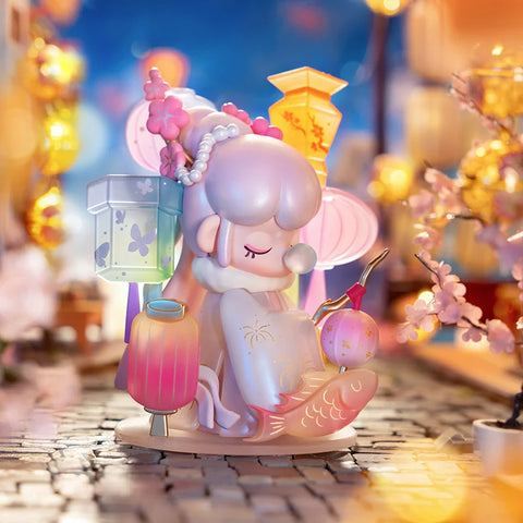 Nanci is standing on a lantern lit street while holding a lantern. There are three lanterns behind her that are part of her figure. This is also the secret figure for the series.