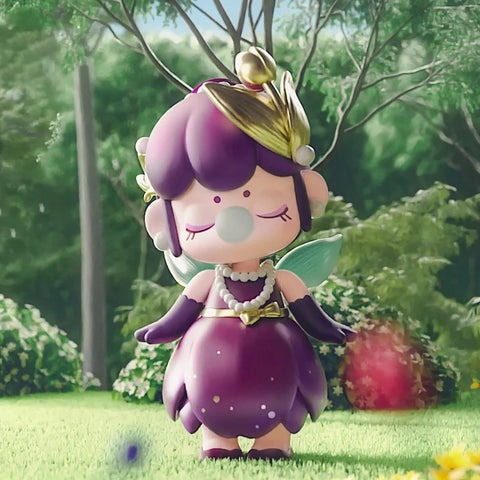 Nanci in a purple dress that resembles a tulip. She is wearing a pearl necklace.