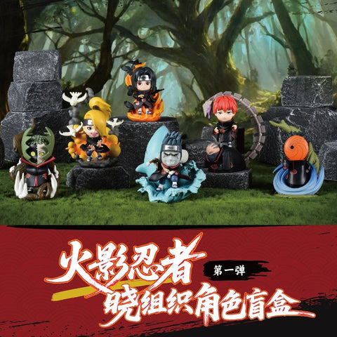 Another group scene showing six Akatsuki members: Deidara, Itachi, Kisame, Sasori, Zetsu, and Tobi. The figures are posed on rocky bases with special effects like crows, smoke, and water, creating a dynamic team arrangement.