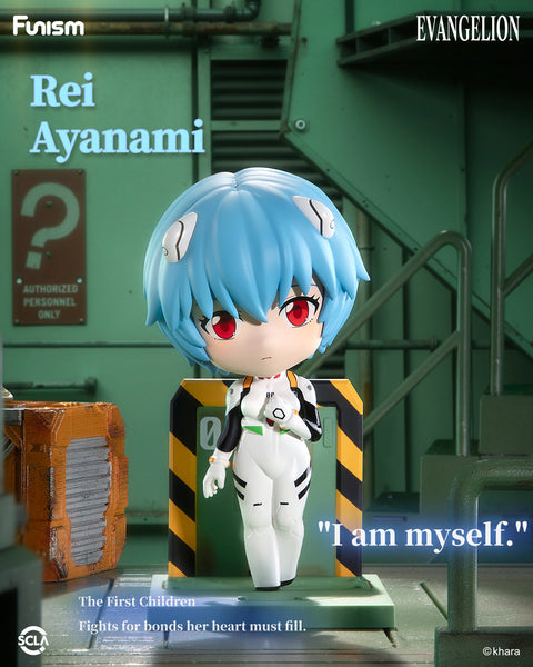 Chibi-style figure of Rei Ayanami with pale skin, blue hair, and red eyes, wearing her white plugsuit, posed calmly on a green platform with Eva design.