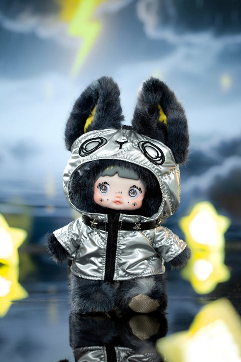 Plush character wearing a metallic silver hooded jacket with black fuzzy ears, standing in reflective water beneath a dramatic storm sky with lightning. The figure’s large shining eyes, bold textures, and high-contrast lighting convey the intensity of a thunderstorm theme.