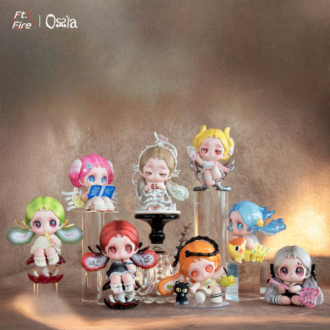 A complete set of eight Ossia figures displayed on pedestals. Each chibi-style character has unique pastel hair and wings, holding objects like books, instruments, or animals. The group is lit warmly against a textured brown backdrop, showcasing every design in detail.