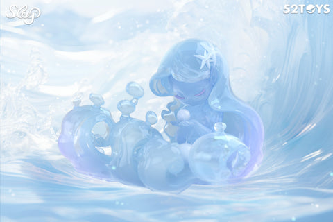 A water-themed figurine from 52TOYS’ Sleep series appears to be sculpted from translucent blue liquid, blending into the swirling ocean around it. With closed eyes and a serene expression, the character gently cradles a pearl while surrounded by fluid, splash-like forms. A starfish adorns her hair, and the entire scene glows with soft light, evoking a peaceful, underwater dreamscape.