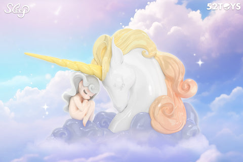 A gentle figurine from 52TOYS’ Sleep series shows a peaceful character with silver hair curled up beside a majestic white unicorn. The unicorn has a golden horn and flowing pastel yellow and peach mane, both resting on soft lavender clouds. Surrounded by glowing stars and a serene sky of soft pinks and blues, the scene radiates warmth, comfort, and magical companionship.