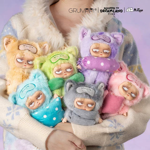 A lifestyle image of a person holding all six characters from the series in their arms, showcasing the full pastel color palette including lavender, lime, peach, grey, pink, and mint.