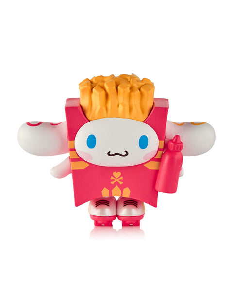 A white Cinnamoroll figure sitting inside a red French fry carton, wearing pink roller skates and holding a red squeeze bottle of ketchup.