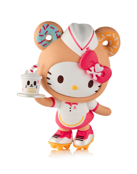 A classic Hello Kitty figure dressed as a retro carhop with a white and pink uniform and yellow roller skates, holding a white milkshake cup detailed with a kitty face and a striped straw.