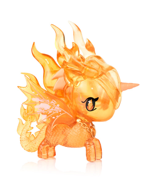 This image shows the Tokidoki Unicorno Mystical Dragon “Ember Dragon,” a transparent orange figure with sculpted flame details on its mane and wings. It has a small horn, bright orange body scales, and gold chain necklace, all captured against a clean white backdrop.