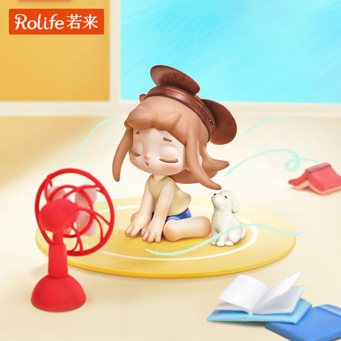 A girl sits cross-legged on a yellow mat in front of a red fan, cooling herself on a hot day. Her hair and shirt flutter with the breeze as she wears a wide brown visor, while a white puppy sits beside her. The details convey nostalgic comfort and the refreshing relief of simple summer moments.