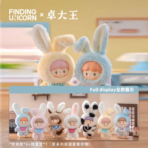 Image showcasing the "Finding Unicorn × 卓大王" Zoton Delicious Bunny Plush Series Blind Box collection. The top half features two plush figures in yellow and blue bunny suits with cheerful expressions. The bottom half displays the full series lineup of 8 plush figures in various pastel and earthy-colored bunny outfits, each with distinct facial features, hairstyles, and accessories. The text "Full display 全款展示" and additional product details in Chinese are also visible.