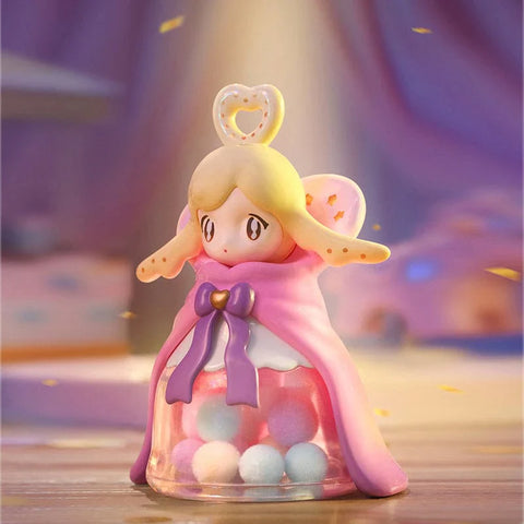 AAMY figure that is reminiscent of a Christmas tree angel. It is all pink with pom poms on the bottom