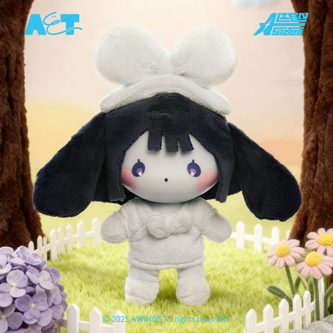 A white furred plush Sua with a large white bow, standing in a garden with a white picket fence and purple flowers.