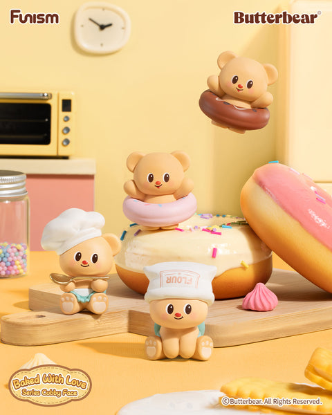 Butterbear figures styled as sweets and bakers from the “Baked With Love” collection. Bears perch inside donuts, balance atop frosting, or wear flour hats and chef caps. Each cub brings a unique personality, from Chocolate Cheer to Strawberry Surprise, with hidden chaser editions adding mystery and delight.