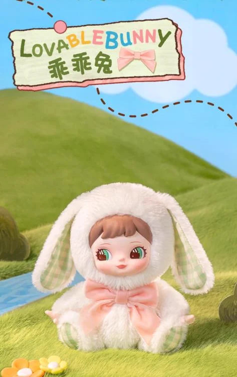 Charline wearing a soft white rabbit costume with long floppy ears and a sweet, blushing vinyl face.
