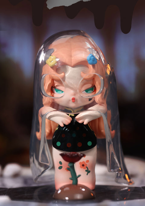 A mystical collectible figurine from the "DODO NAMI Paradise of Doom" series features a character with flowing peach-colored hair, adorned with small flower decorations. She has piercing green eyes and wears a black dress with colorful polka dots. A translucent veil encases her, giving an ethereal, otherworldly feel. A dark flower grows from her leg, blending her with the ground. Her solemn expression and ghostly aura evoke a haunting yet mesmerizing presence in a surreal, dreamlike setting.