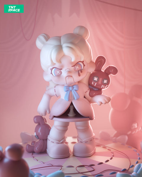 A 3D-rendered Dora figurine stands on a pink circus-like stage, resembling a marionette with stitched details and an eerie, doll-like appearance. She has pale white hair in two buns, X-shaped pupils, and a distressed expression with black tears. A blue bow adorns her dress, which reveals puppet strings inside. She holds a red stitched bunny with X eyes, while more plush toys lay scattered around. The dim pink lighting and shadowy backdrop create an unsettling yet captivating atmosphere.