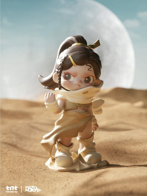 Dora Material Vistas Series figure "Dust," a desert-inspired character with dark hair tied up, sandy flowing attire, and determined expression, standing against a moonlit desert landscape.