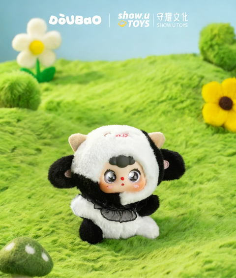 Doubao dressed in a black and white cow-patterned plush suit with tiny tan horns and a black ruffled collar.