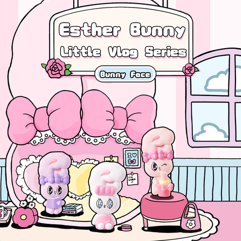 A pastel-pink living room scene filled with multiple Esther Bunny Little Vlog Bunny Face figures, each with oversized bunny ears styled like question marks. The figures come in pink, purple, and white variations, posed on a yellow sofa, rug, and small props. The overall aesthetic is soft, kawaii, and playful, capturing a cozy lifestyle vibe.