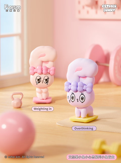 Two bunnies posed on scales, one looking determined while the other appears stressed with spiraled eyes. The pastel gym setting with weights and dumbbells creates a humorous scene about fitness and self-image.