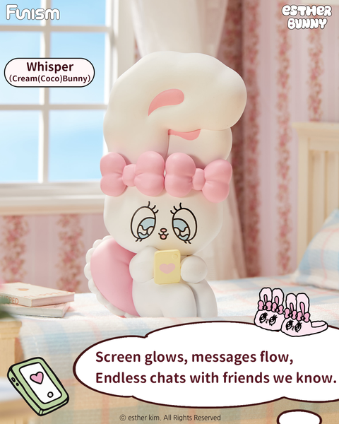 A white bunny with a large pink bow named Cream (Coco) Bunny sits on a pastel bed, holding a yellow phone with a heart on it. The bunny’s cheeks are blushed, and the scene features floral wallpaper, sunlight through the window, and cozy bedding in pink and blue plaid.
