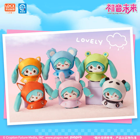 Group lineup of six Hatsune Miku Rainy Day plush designs, including fox, frog, panda, rabbit, koala, and kitty. Each wears a themed raincoat with matching ears or hoods, showing cheerful or sleepy expressions. Displayed on pastel blocks against a soft gradient backdrop with “LOVELY” text and doodle clouds.