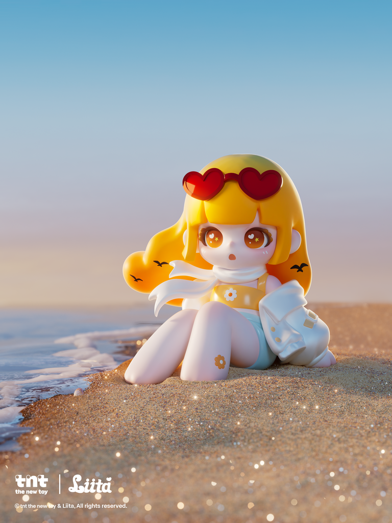 A small figurine with long yellow hair sits on a sandy shoreline at the water’s edge, wearing red heart-shaped sunglasses on her head, a white scarf, and a yellow top with a flower accent. Soft waves reach her feet as warm sunset light highlights the sparkles scattered across the wet sand around her.