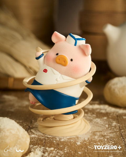 LuLu the Piggy dressed as a chef in a white uniform and blue apron. The figure is captured in a dynamic spinning pose with ribbons of noodles swirling around its body.